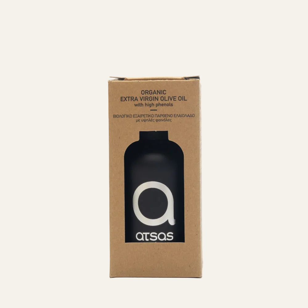 Cardboard box packaging for organic extra virgin olive oil with a black bottle on a white background