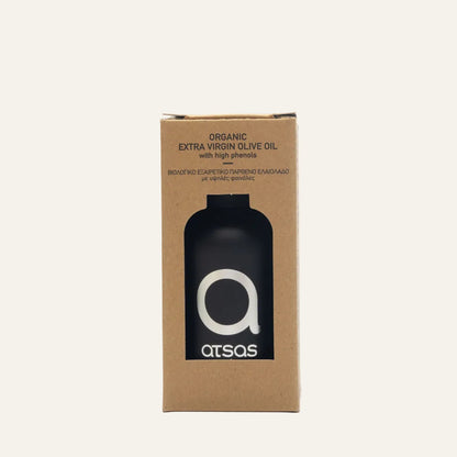 Cardboard box packaging for organic extra virgin olive oil with a black bottle on a white background