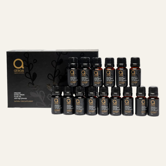 Collection of Atsas EVOO 15 black bottles with a central box featuring a logo on a white background